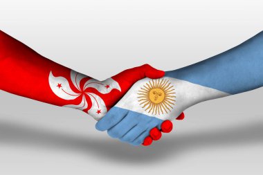 Handshake between argentina and hong kong flags painted on hands, illustration with clipping path.