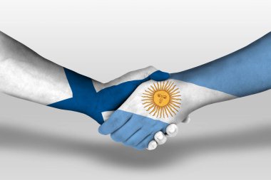 Handshake between argentina and finland flags painted on hands, illustration with clipping path.
