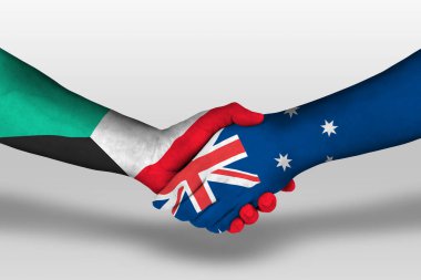 Handshake between Australia and Kuwait flags painted on hands, illustration with clipping path.