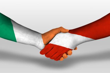 Handshake between austria and ireland flags painted on hands, illustration with clipping path.