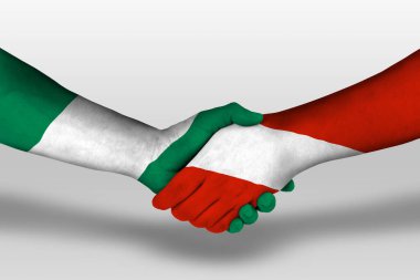 Handshake between austria and nigeria flags painted on hands, illustration with clipping path.