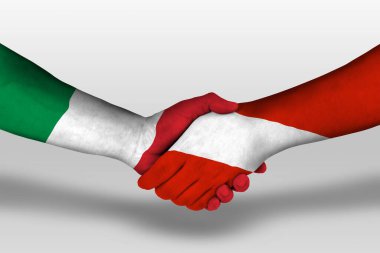 Handshake between austria and italy flags painted on hands, illustration with clipping path.