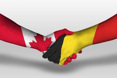 Handshake between belgium and canada flags painted on hands, illustration with clipping path.