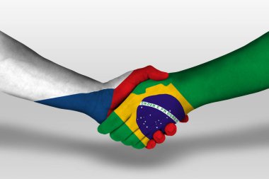 Handshake between brazil and czech republic flags painted on hands, illustration with clipping path.