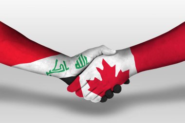 Handshake between canada and iraq flags painted on hands, illustration with clipping path.