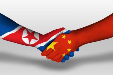 Handshake between china and north korea flags painted on hands, illustration with clipping path.