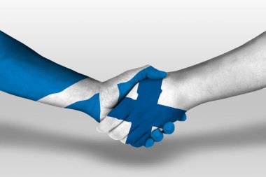 Handshake between finland and scotland flags painted on hands, illustration with clipping path.
