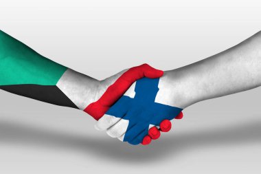Handshake between finland and kuwait flags painted on hands, illustration with clipping path.