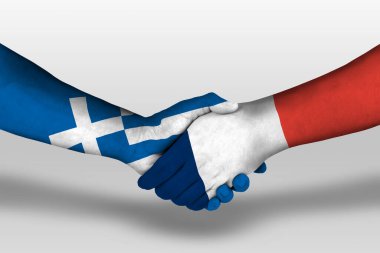 Handshake between france and greece flags painted on hands, illustration with clipping path.