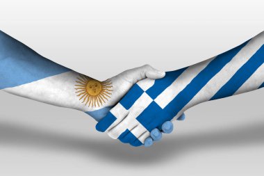 Handshake between greece and argentina flags painted on hands, illustration with clipping path.