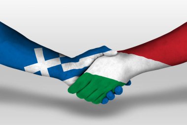 Handshake between hungary and greece flags painted on hands, illustration with clipping path.