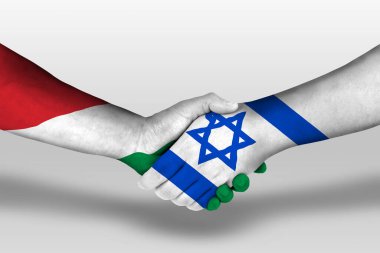 Handshake between israel and hungary flags painted on hands, illustration with clipping path.