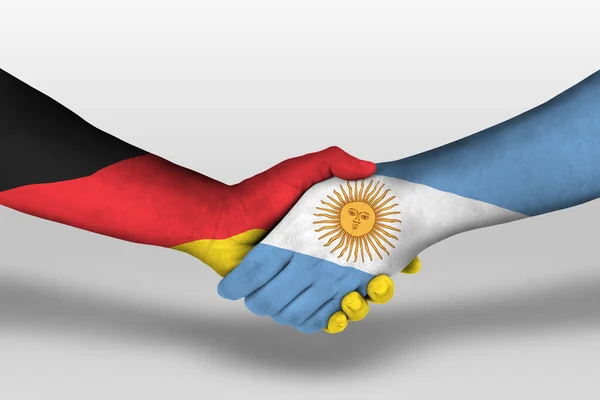 Рукопожатие Между Аргентинскими Германскими Флагами Раскрашенными Руках Иллюстрация Вырезкой — стоковое фото