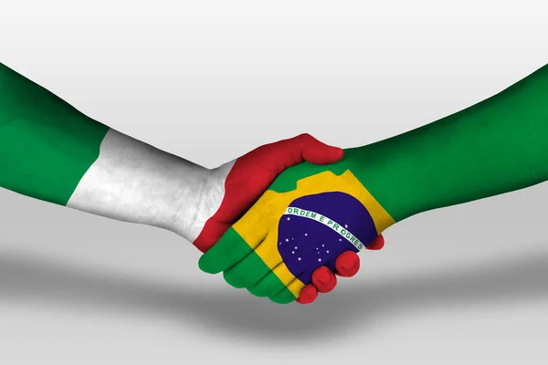 Handshake between brazil and italy flags painted on hands, illustration with clipping path.
