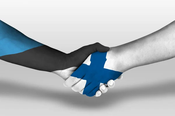 Ruční Podání Mezi Finlandskými Estonskými Vlajkami Namalovanými Rukou Ilustrace Oříznutou — Stock fotografie
