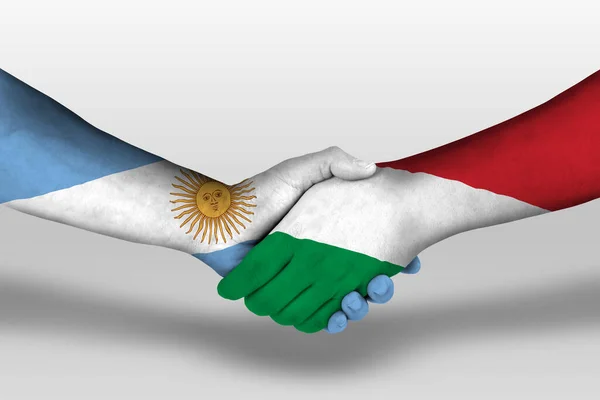 Рукопожатие Между Венгерскими Аргентинскими Флагами Нарисованными Руках Иллюстрация Вырезкой — стоковое фото