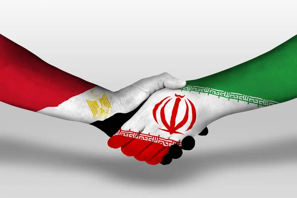 Handshake between iran and egypt flags painted on hands, illustration with clipping path.
