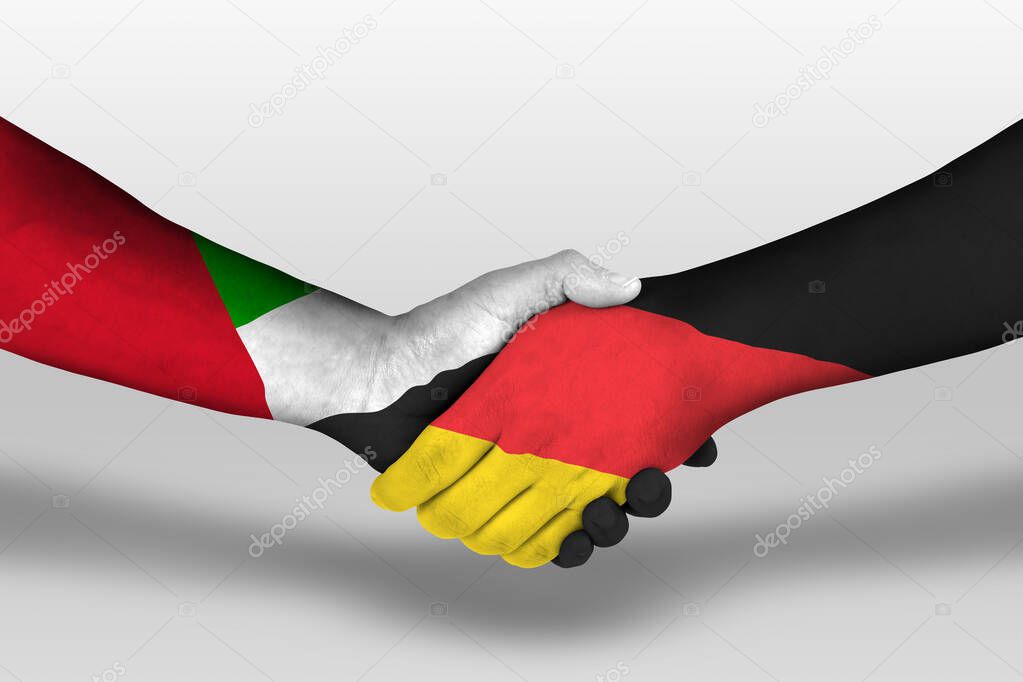 Handshake between germany and united arab emirates flags painted on hands, illustration with clipping path.