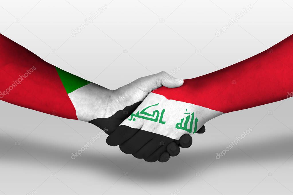 Handshake between iraq and united arab emirates flags painted on hands, illustration with clipping path.