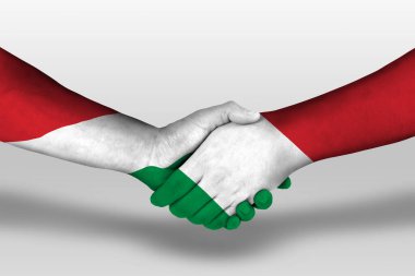 Ellere boyanmış İtalya ve Hungary bayrakları arasında el sıkışma, kırpma yolu ile illüstrasyon.