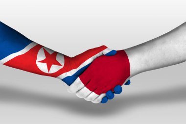 Handshake between japan and north korea flags painted on hands, illustration with clipping path.