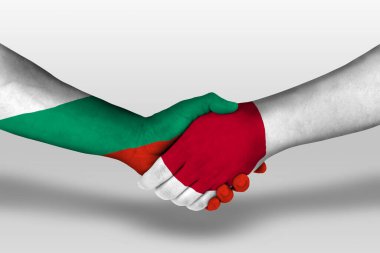 Handshake between japan and bulgaria flags painted on hands, illustration with clipping path.