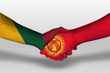 Handshake between kyrgyzstan and lithuania flags painted on hands, illustration with clipping path.