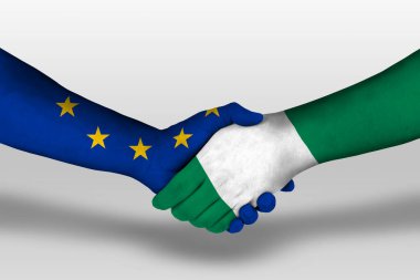 Handshake between nigeria and european union flags painted on hands, illustration with clipping path.