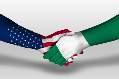 Handshake between nigeria and united states of america flags painted on hands, illustration with clipping path.