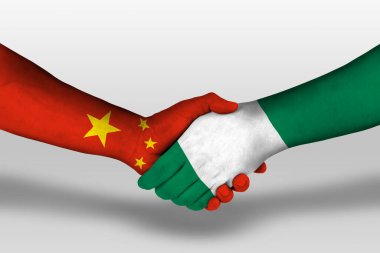 Handshake between nigeria and china flags painted on hands, illustration with clipping path.