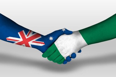 Nijerya ve Avustralya bayrakları arasındaki el sıkışma ellerinde resim ve kırpma yolu..