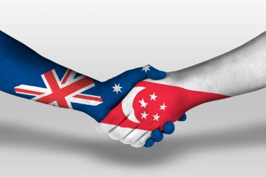 Handshake between singapore and australia flags painted on hands, illustration with clipping path.
