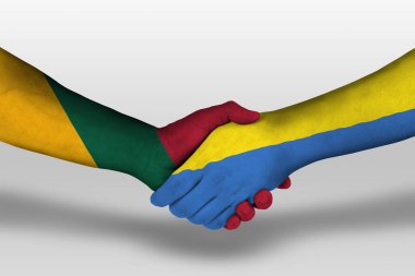 Handshake between ukraine and lithuania flags painted on hands, illustration with clipping path. clipart