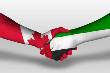 Handshake between united arab emirates and canada flags painted on hands, illustration with clipping path.