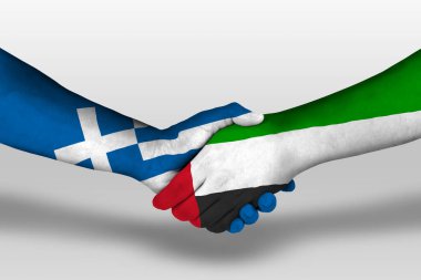 Handshake between united arab emirates and greece flags painted on hands, illustration with clipping path.