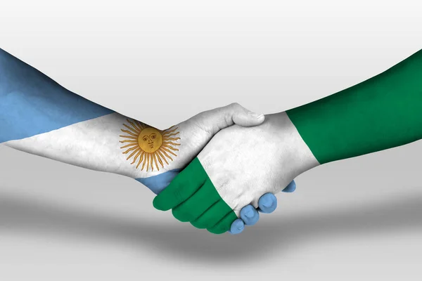 Uścisk Dłoni Między Nigeryjskimi Argentyńskimi Flagami Namalowanymi Rękach Ilustracja Ścieżką — Zdjęcie stockowe