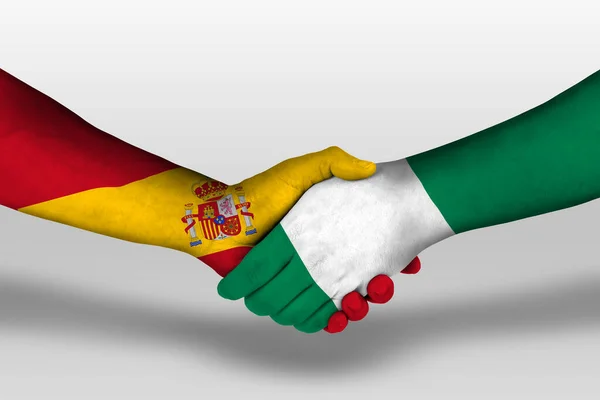 Uścisk Dłoni Między Nigeryjskimi Hiszpańskimi Flagami Namalowanymi Dłoniach Ilustracja Ścieżką — Zdjęcie stockowe