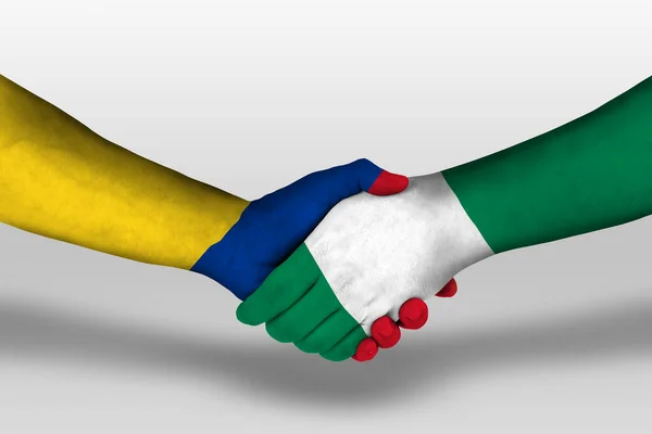 Handdruk Tussen Nigeria Columbia Vlaggen Geschilderd Handen Illustratie Met Clipping — Stockfoto
