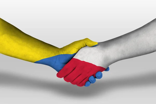 Handshake between poland and ukraine flags painted on hands, illustration with clipping path.