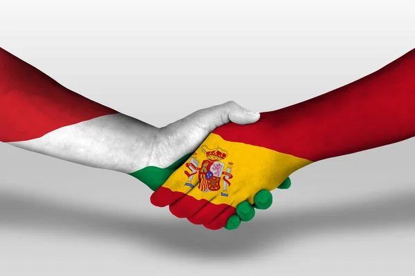 Uścisk Dłoni Między Hiszpanią Malowanymi Rękach Węgierskimi Flagami Ilustracja Ścieżką — Zdjęcie stockowe