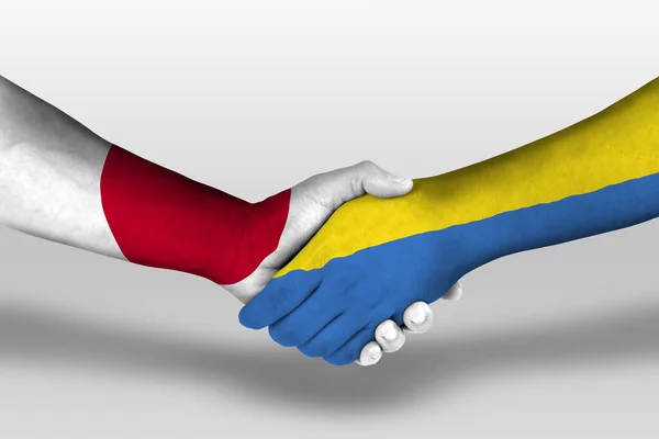 Handdruk Tussen Ukraine Japanse Vlaggen Geschilderd Handen Illustratie Met Knippad — Stockfoto