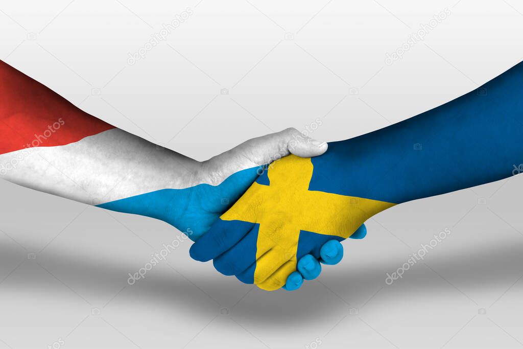 Handshake between sweden and luxembourg flags painted on hands, illustration with clipping path.