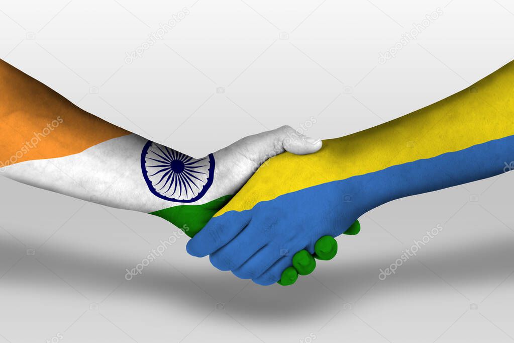 Handshake between ukraine and india flags painted on hands, illustration with clipping path.