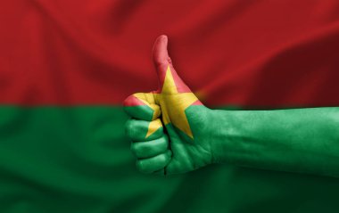 Burkina faso bayrağıyla boyanmış el yapımı başparmak.