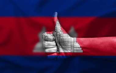 Hand making thumb up painted with flag of cambodia