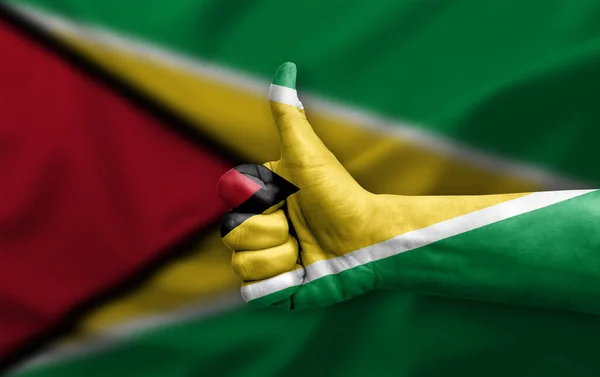 Mão Fazendo Polegar Para Cima Pintado Com Bandeira Guiana — Fotografia de Stock