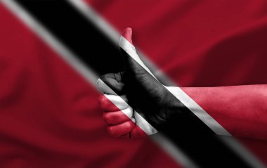 El yapımı başparmak Trinidad Tobago bayrağıyla boyanmış.