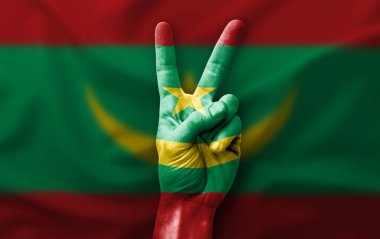 Hand making the V victory sign with flag of mauritania