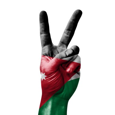 Jordan bayrağıyla zafer işareti yapıyor.