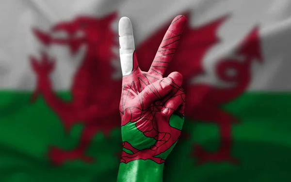 Hand Making Victory Sign Flag Wales — Stockfoto